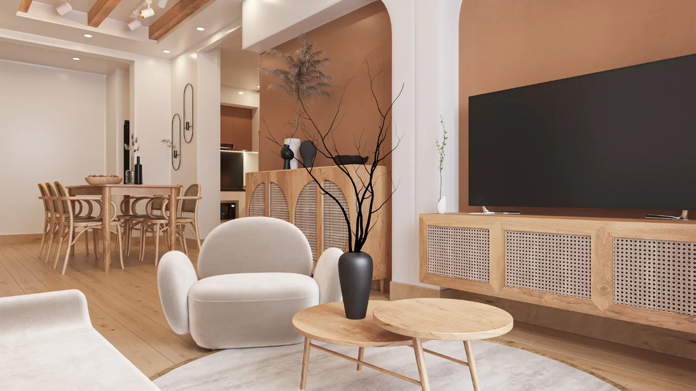 Séjour chaleureux aux murs terracotta, fauteuil bouclette crème, tables basses en chêne et meubles en cannage